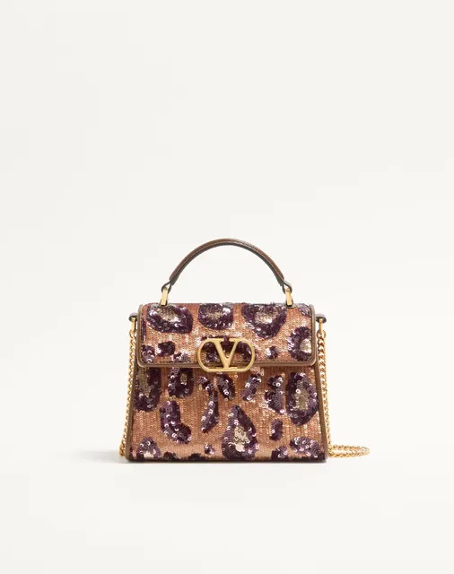 Мини-сумка с ручкой Valentino Garavani VSLING с анималистичной вышивкой