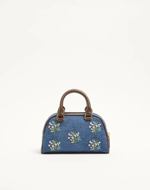 Мини-сумка-боулинг Valentino Garavani VLogo Signature из денима с цветочной вышивкой